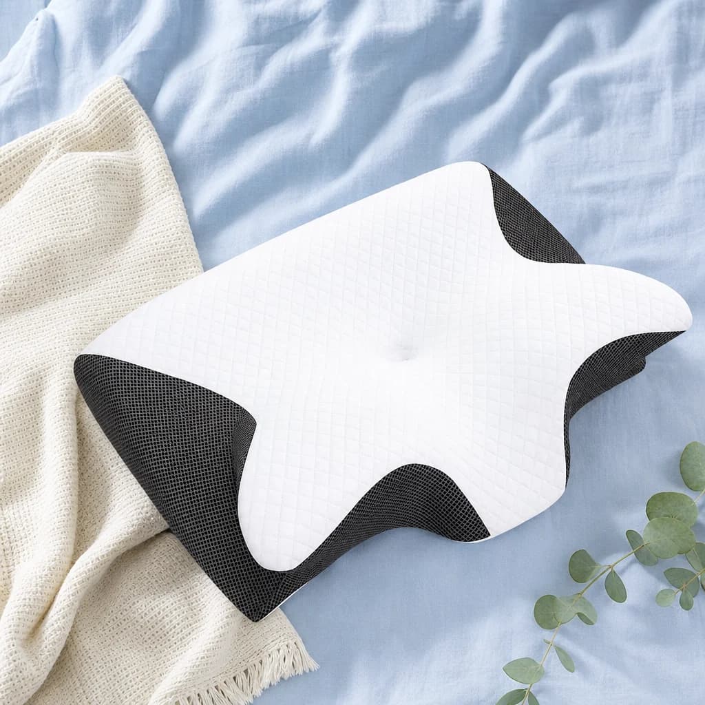 The Cloud Pillow styled on soft blue linen